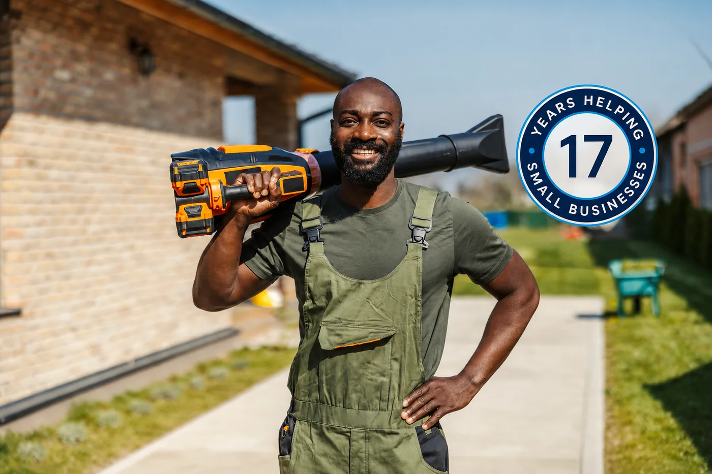 A local service contractor standing on a driveway in front of a home.